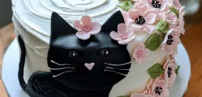Baking a Pawsome Creation: Black Cat-Themed Cake with Floral Cascade